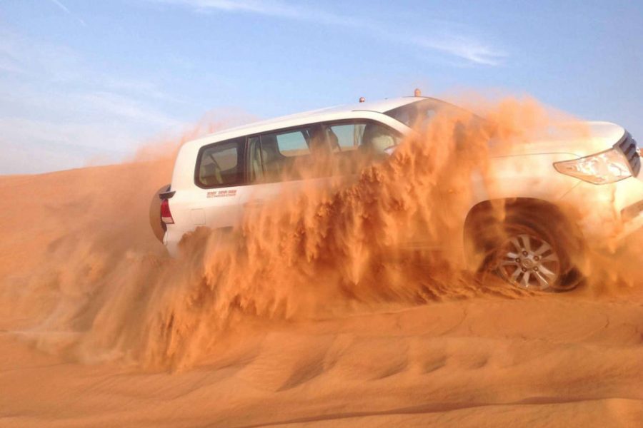Dubai Evening Desert Safari: Sandboarding, Camel Ride + BBQ Dinner